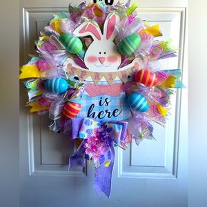 This colorful Easter/spring wreath is handmade. Will look great on your door.